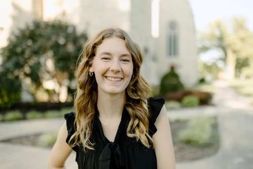 graduating college student smiling